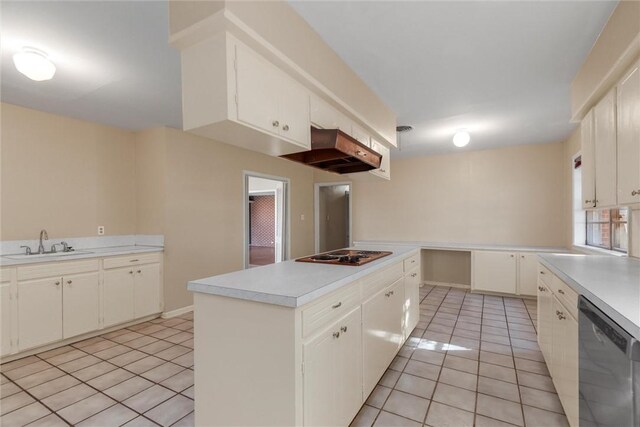 kitchen featuring white cabinets, sink, light tile patterned floors, and stainless steel appliances