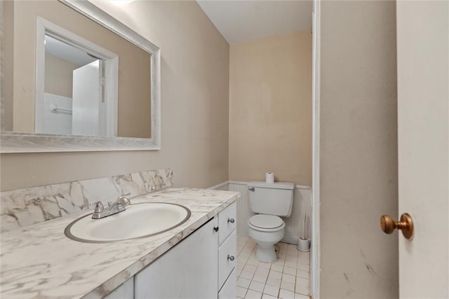 bathroom with tile patterned floors, vanity, and toilet