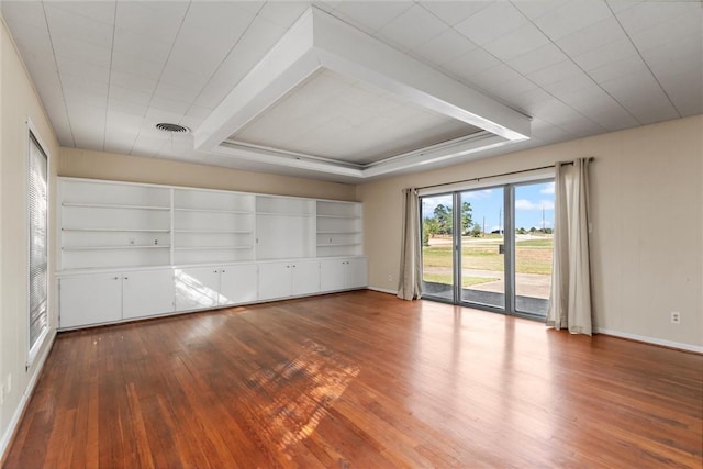 unfurnished bedroom featuring access to exterior and wood-type flooring