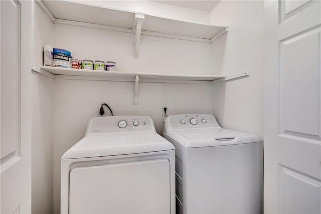 laundry room with laundry area and washer and clothes dryer