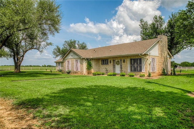 18222 N Fm 486, Buckholts, TX 76518 - view of front facade with a shingled roof, fence, a front yard, and a chimney