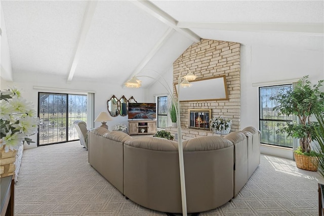 living area featuring beamed ceiling, light carpet, high vaulted ceiling, and a brick fireplace