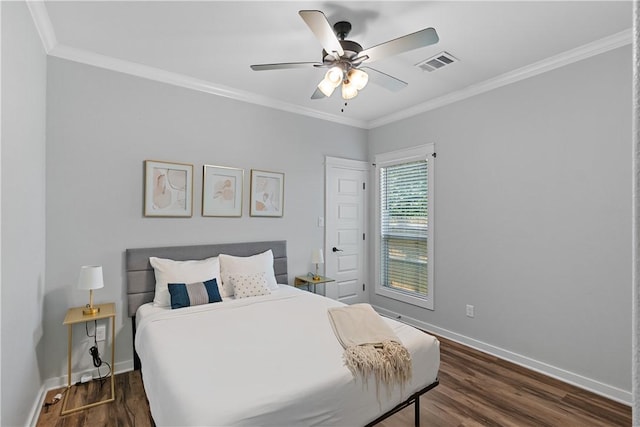 2607 Southside Dr, Bryan, TX 77803 - bedroom with crown molding, visible vents, baseboards, and dark wood-style floors