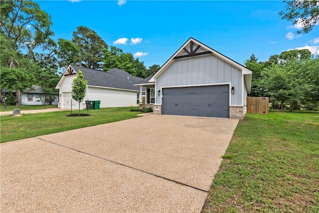 2607 Southside Dr, Bryan, TX 77803 - view of side of home with concrete driveway, board and batten siding, a yard, and an attached garage