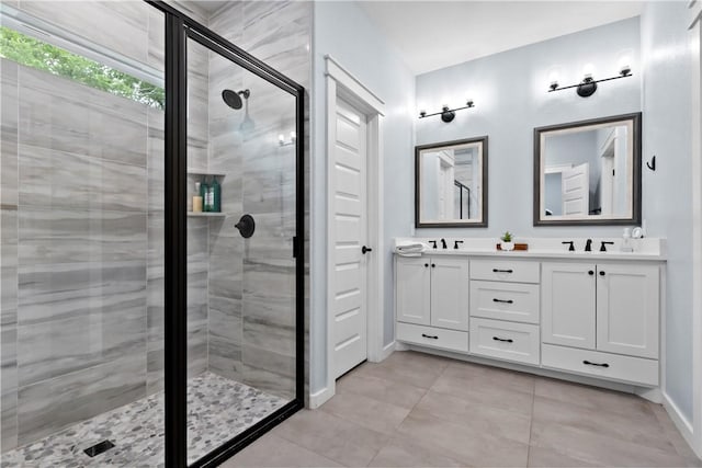2607 Southside Dr, Bryan, TX 77803 - full bath featuring a sink, tile patterned floors, a shower stall, double vanity, and baseboards