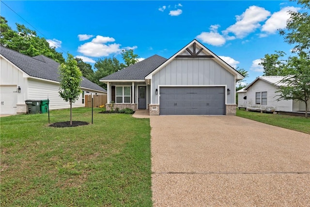 view of front of property with roof with shingles, a garage, board and batten siding, a front yard, and driveway