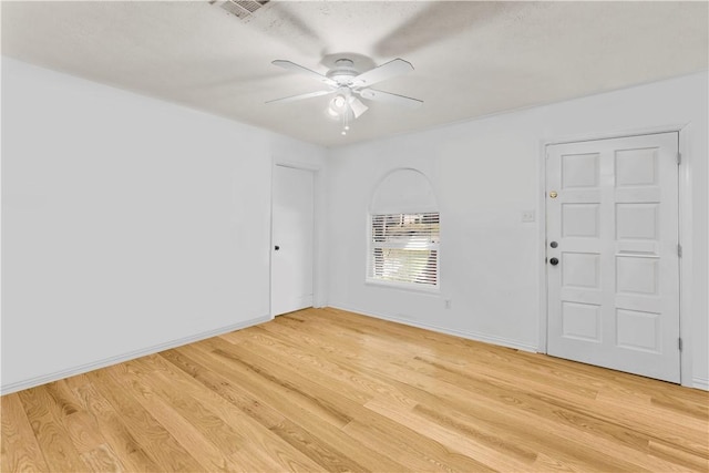 spare room with ceiling fan and light hardwood / wood-style floors