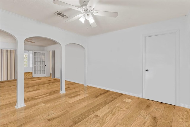 unfurnished room featuring ceiling fan and light wood-type flooring