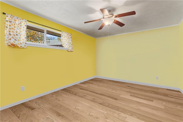 empty room featuring ornamental molding, ceiling fan, a textured ceiling, and light hardwood / wood-style floors