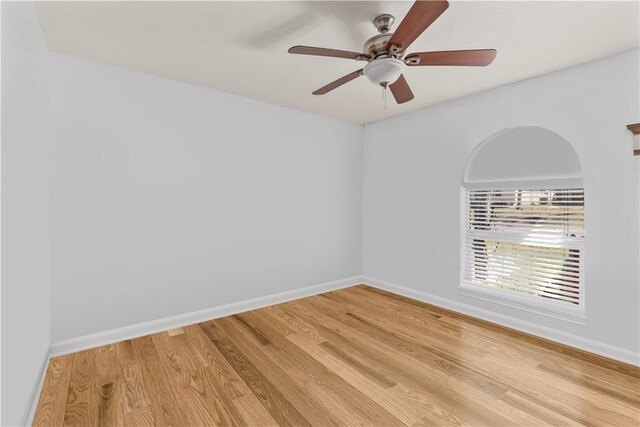 unfurnished room featuring ceiling fan and wood-type flooring