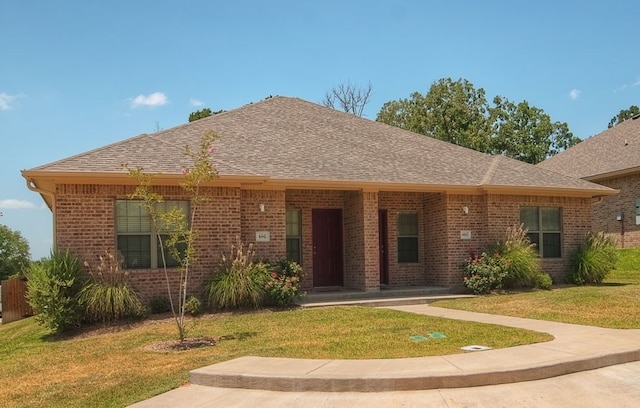 ranch-style home featuring a front yard