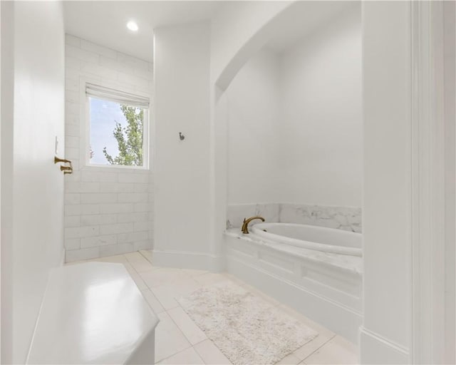 4231 Villaggio Ct, Bryan, TX 77802 - bathroom with a bath and tile patterned floors