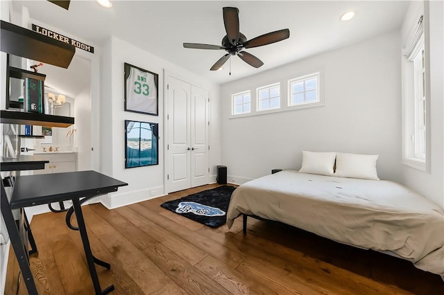 4231 Villaggio Ct, Bryan, TX 77802 - bedroom with wood finished floors, recessed lighting, and a closet