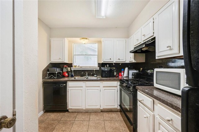 1008 Cedar Run, College Station, TX 77840 - kitchen with under cabinet range hood, black appliances, a sink, dark countertops, and white cabinets