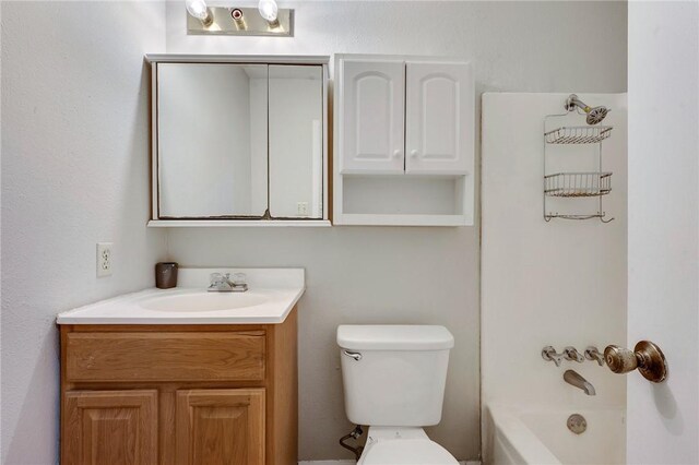 1008 Cedar Run, College Station, TX 77840 - bathroom with vanity, toilet, and bathing tub / shower combination