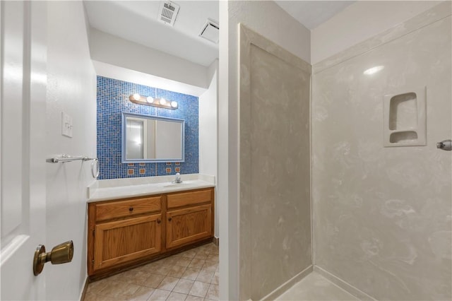 full bathroom featuring visible vents, tile patterned flooring, and vanity
