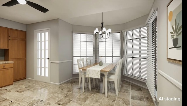 dining room with baseboards, stone finish flooring, a wealth of natural light, and ceiling fan with notable chandelier