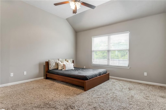 bedroom featuring ceiling fan, lofted ceiling, and carpet