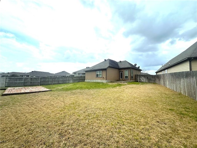 view of yard with a fenced backyard