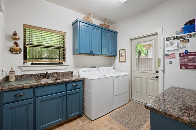 laundry room featuring a sink, cabinet space, and washing machine and clothes dryer