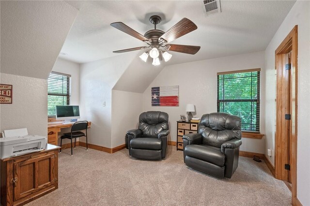 living area featuring a ceiling fan, light colored carpet, and baseboards