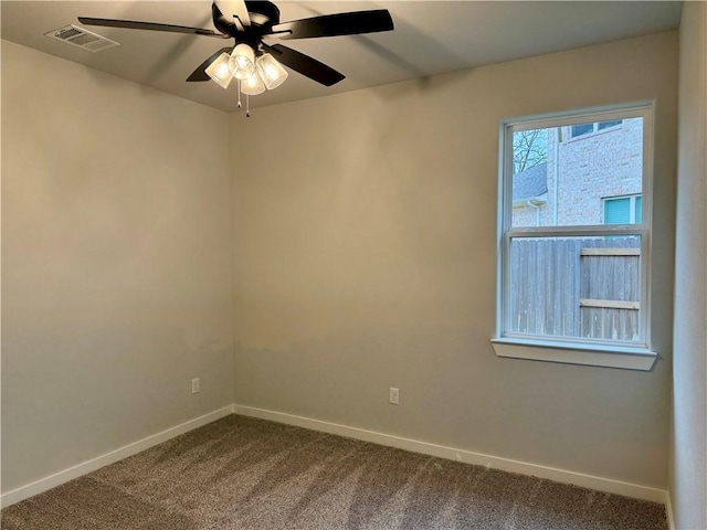 carpeted empty room featuring ceiling fan