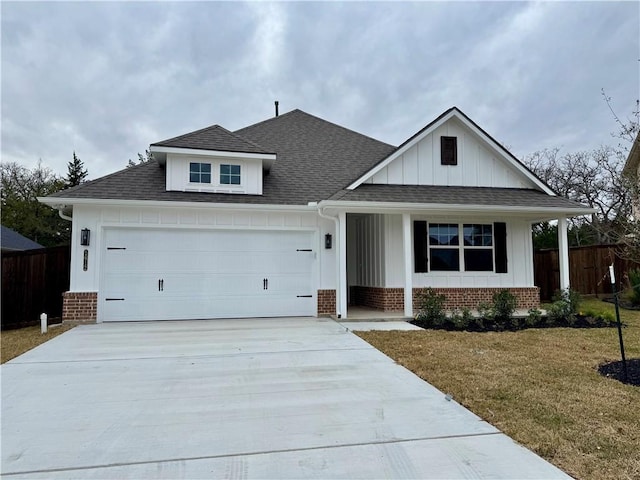 view of front facade with a front yard and a garage