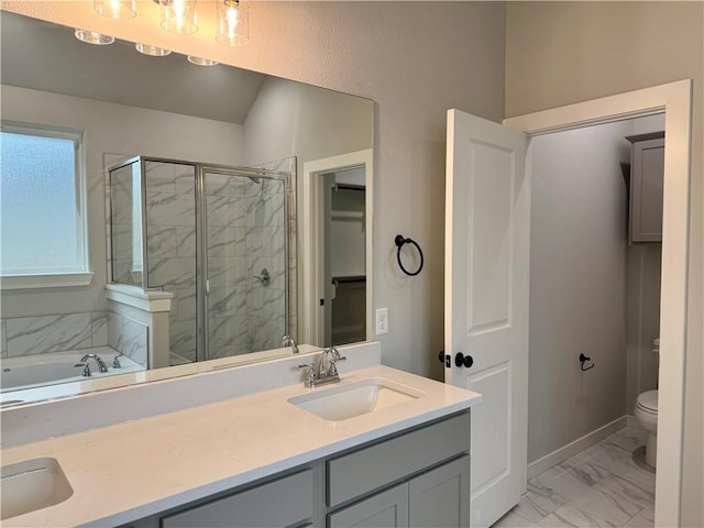 full bathroom featuring toilet, vanity, and shower with separate bathtub