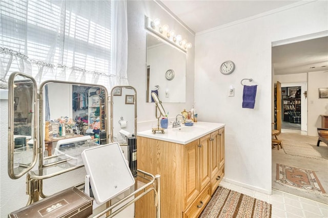 bathroom featuring vanity and ornamental molding