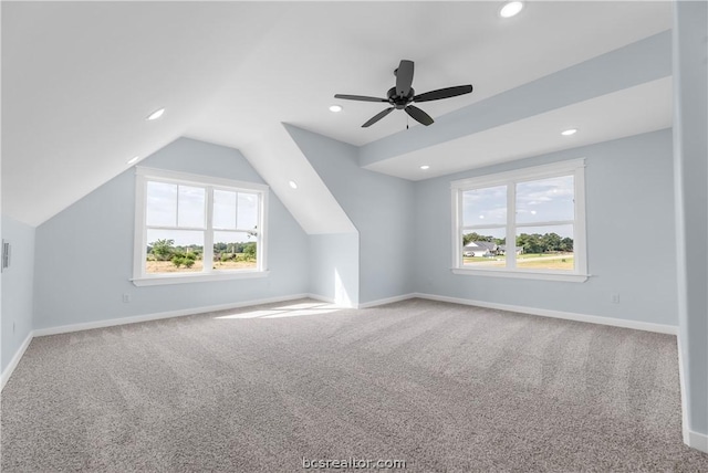 additional living space with carpet flooring, vaulted ceiling, and ceiling fan