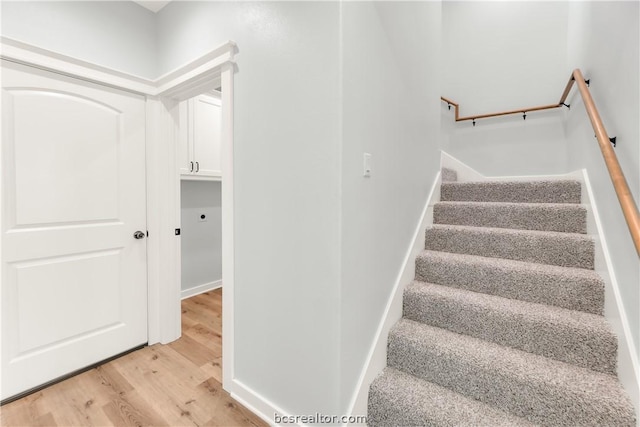 stairs with wood-type flooring