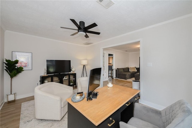 750 Garden Acres Blvd, Bryan, TX 77802 - living area with light wood-type flooring, a ceiling fan, and ornamental molding