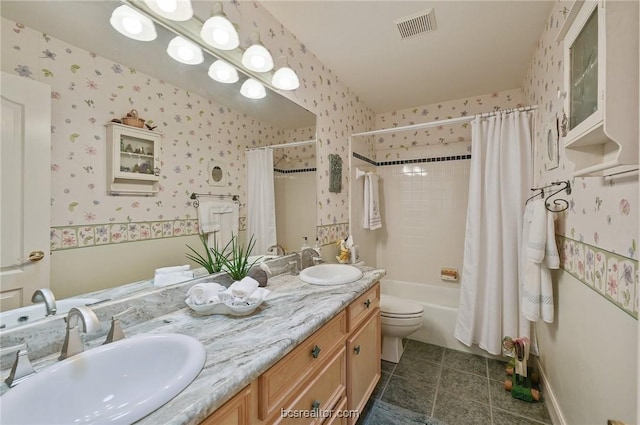 full bathroom with tile patterned floors, vanity, toilet, and shower / tub combo