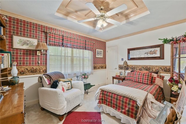 bedroom with ceiling fan, a raised ceiling, and multiple windows