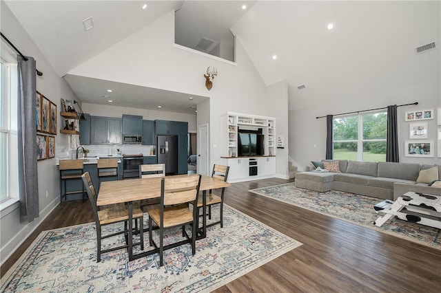 9159 Fm 1362 N, Caldwell, TX 77836 - dining room featuring high vaulted ceiling, dark wood-style flooring, and recessed lighting