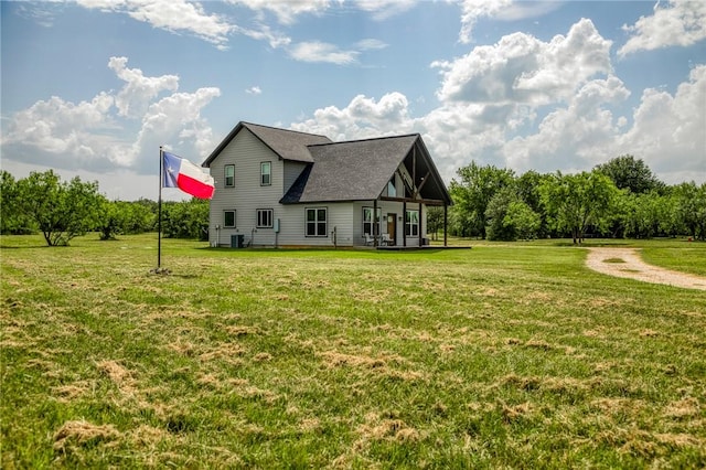 9159 Fm 1362 N, Caldwell, TX 77836 - rear view of property with a lawn and roof with shingles