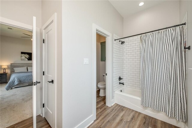 9159 Fm 1362 N, Caldwell, TX 77836 - bathroom featuring shower / bathtub combination with curtain, wood finished floors, connected bathroom, a ceiling fan, and recessed lighting