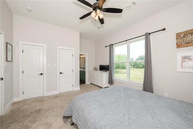 9159 Fm 1362 N, Caldwell, TX 77836 - bedroom featuring light colored carpet, ensuite bath, and ceiling fan