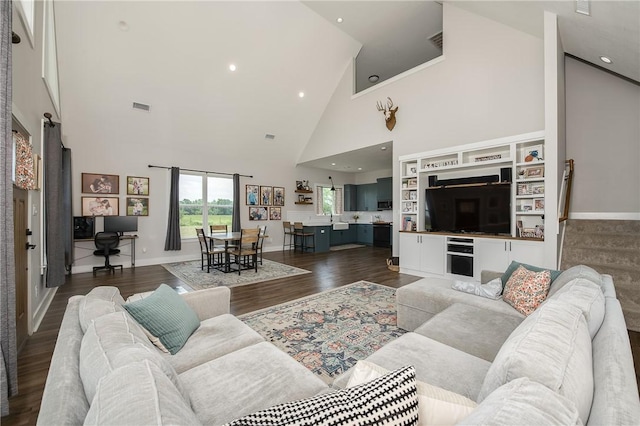 9159 Fm 1362 N, Caldwell, TX 77836 - living room featuring high vaulted ceiling, wood finished floors, and recessed lighting