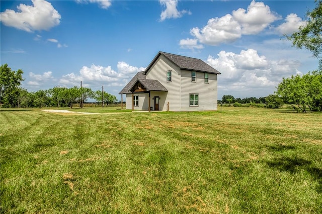 9159 Fm 1362 N, Caldwell, TX 77836 - back of house featuring a yard and a shingled roof