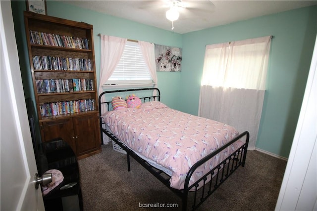 carpeted bedroom with multiple windows and ceiling fan