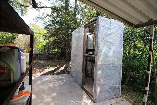 view of patio / terrace featuring an outbuilding