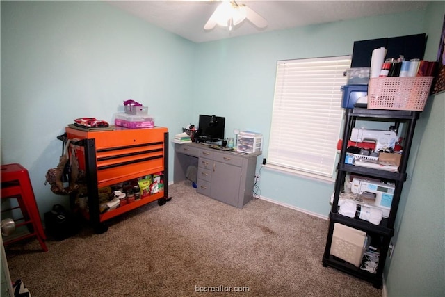 carpeted home office with ceiling fan