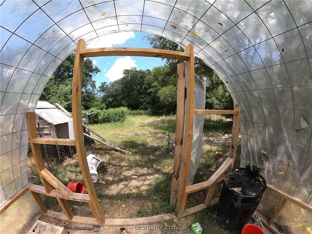 exterior space with lofted ceiling