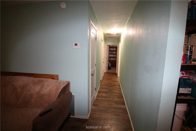 hallway featuring dark hardwood / wood-style flooring