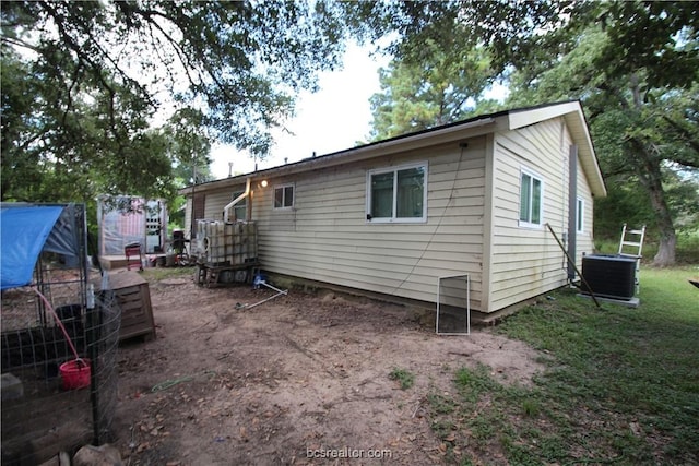 rear view of property with central air condition unit