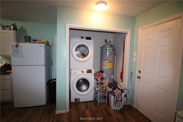 laundry room featuring water heater, dark hardwood / wood-style flooring, a textured ceiling, and stacked washer and clothes dryer