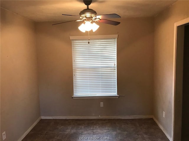 spare room with ceiling fan