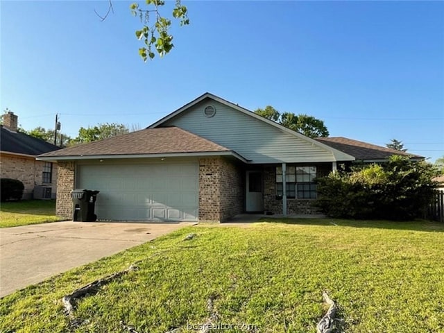 single story home featuring a garage and a front lawn