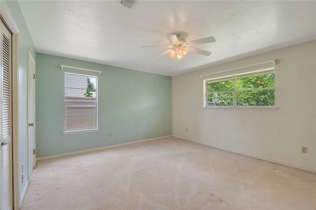1905 Nueces Dr, College Station, TX 77840 - carpeted spare room with a ceiling fan and baseboards